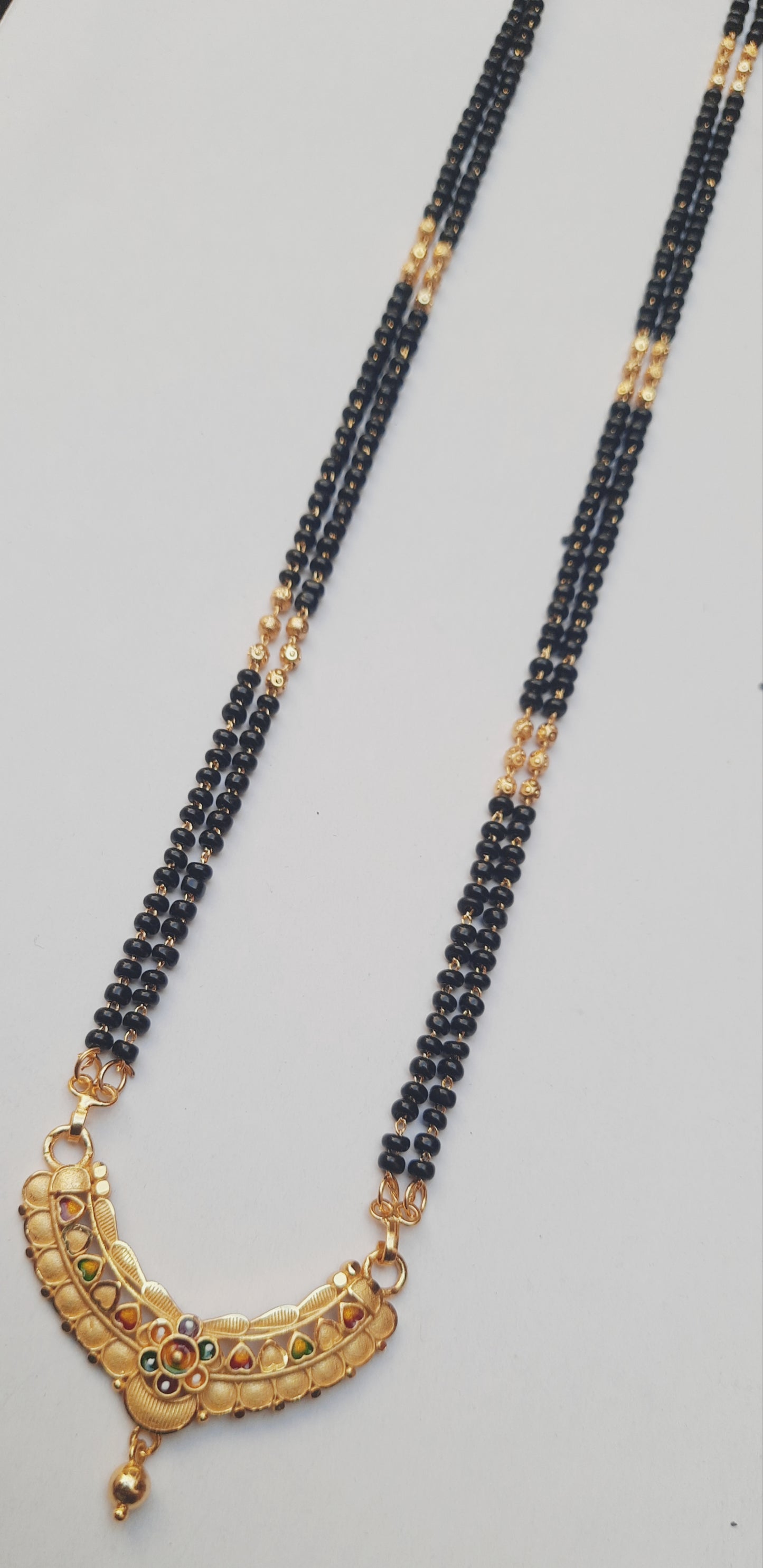 Golden mangalsutra Long 1 gram golden polish made with original A.D. stones , 30"inch long DAILY USE, 6 MONTHS WARANTY