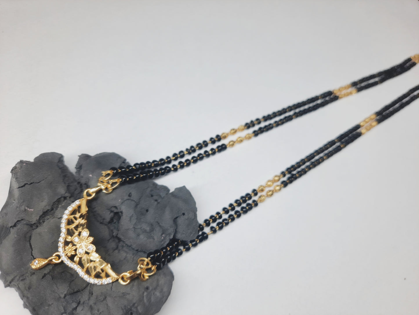 Golden mangalsutra Long 1 gram golden polish made with original A.D. stones , 30"inch long DAILY USE, 6 MONTHS WARANTY