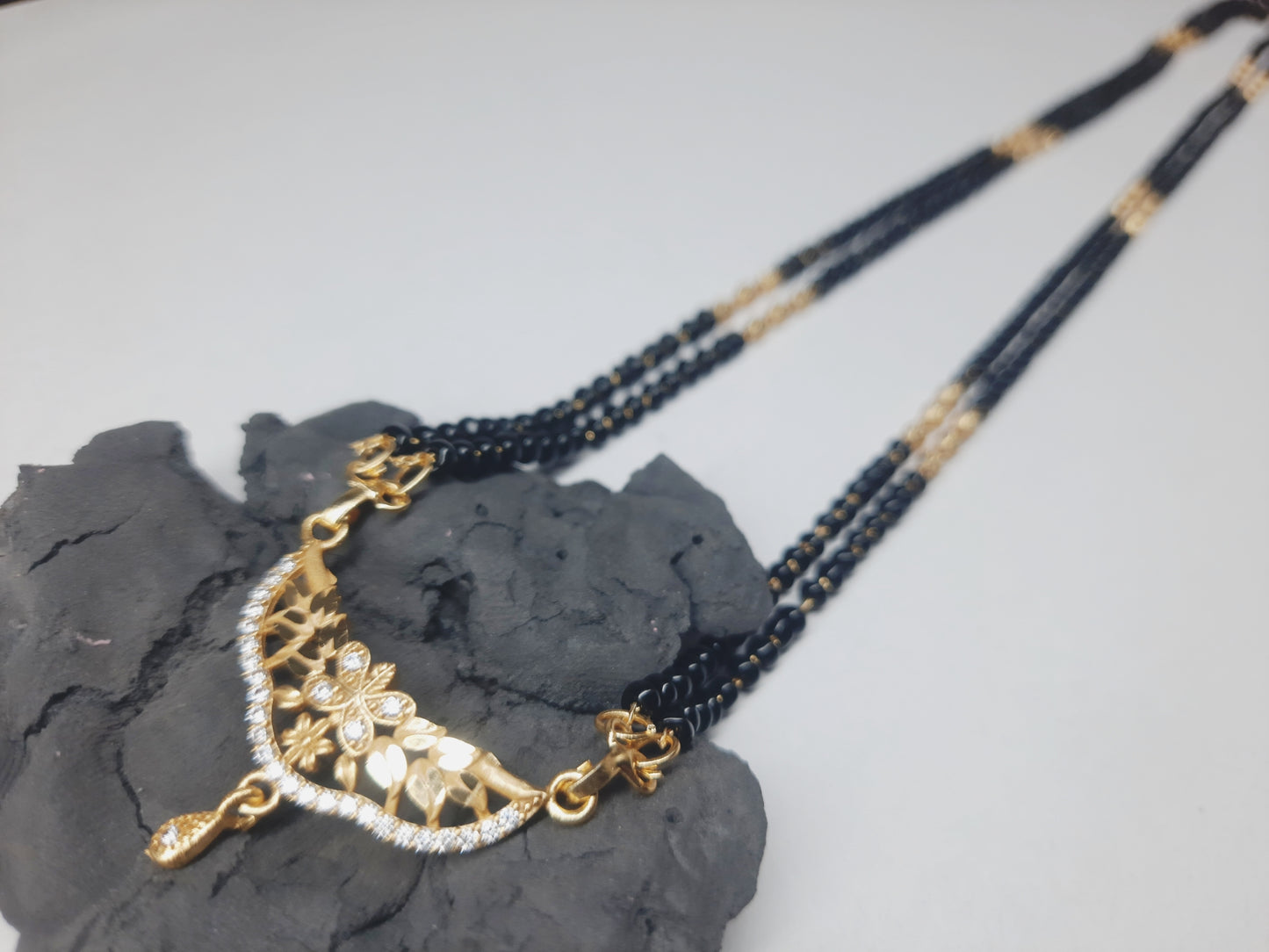 Golden mangalsutra Long 1 gram golden polish made with original A.D. stones , 30"inch long DAILY USE, 6 MONTHS WARANTY